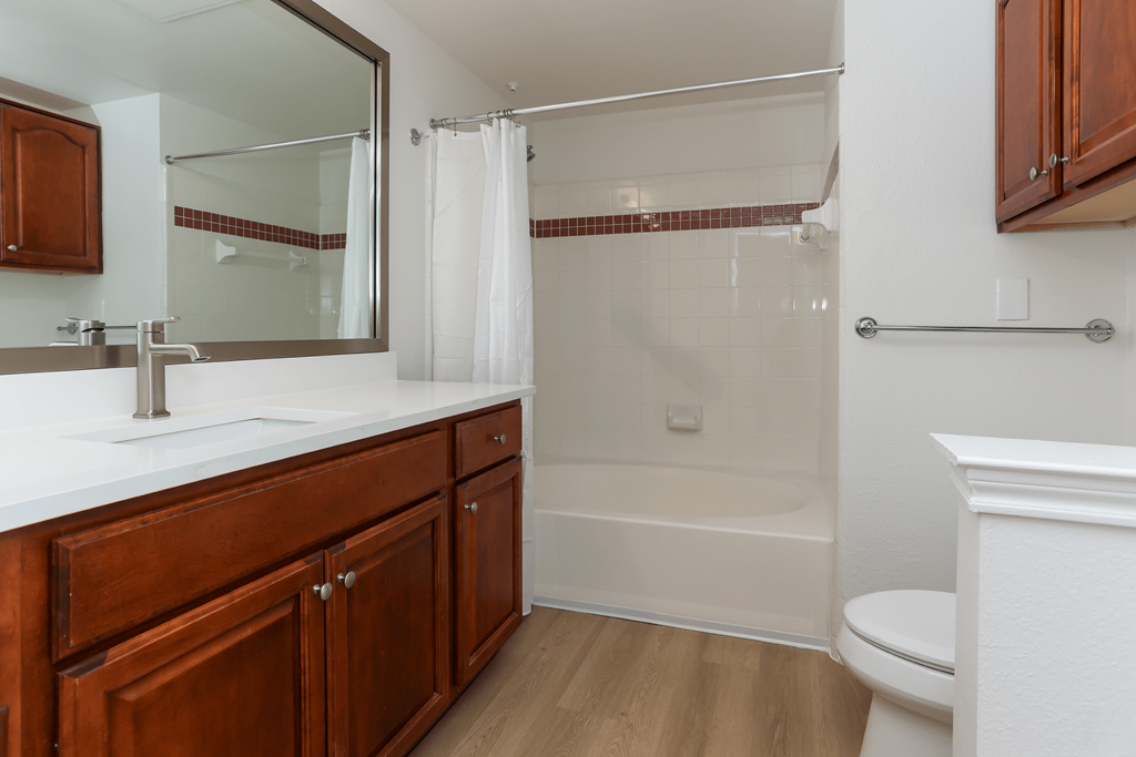 A bathroom with a white toilet and a white sink.
